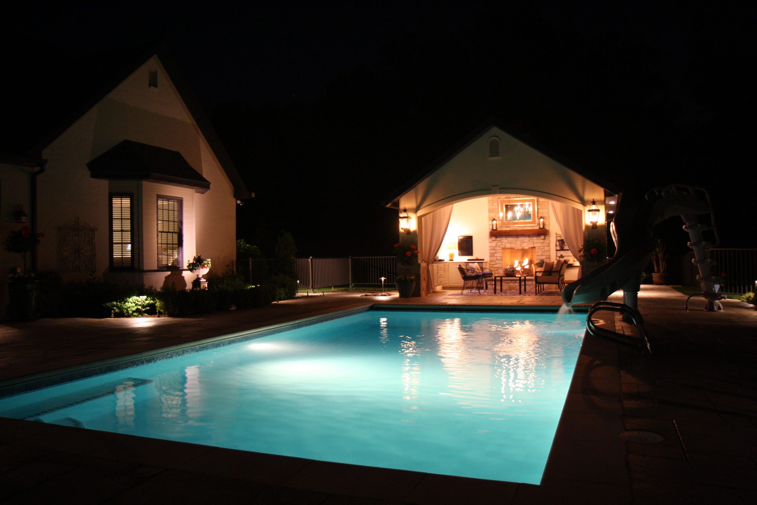 Traditional Pool at Night w_ Pool House
