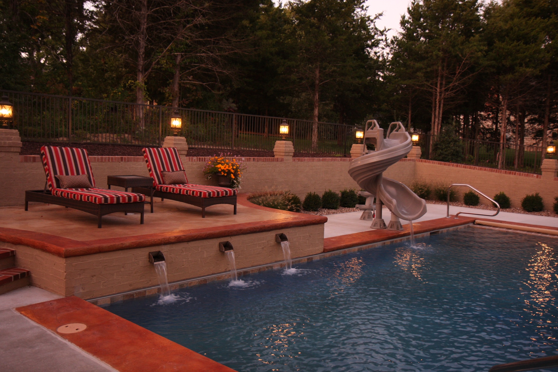 Blunt Traditional Pool Waterfall Feature & Chairs Dusk