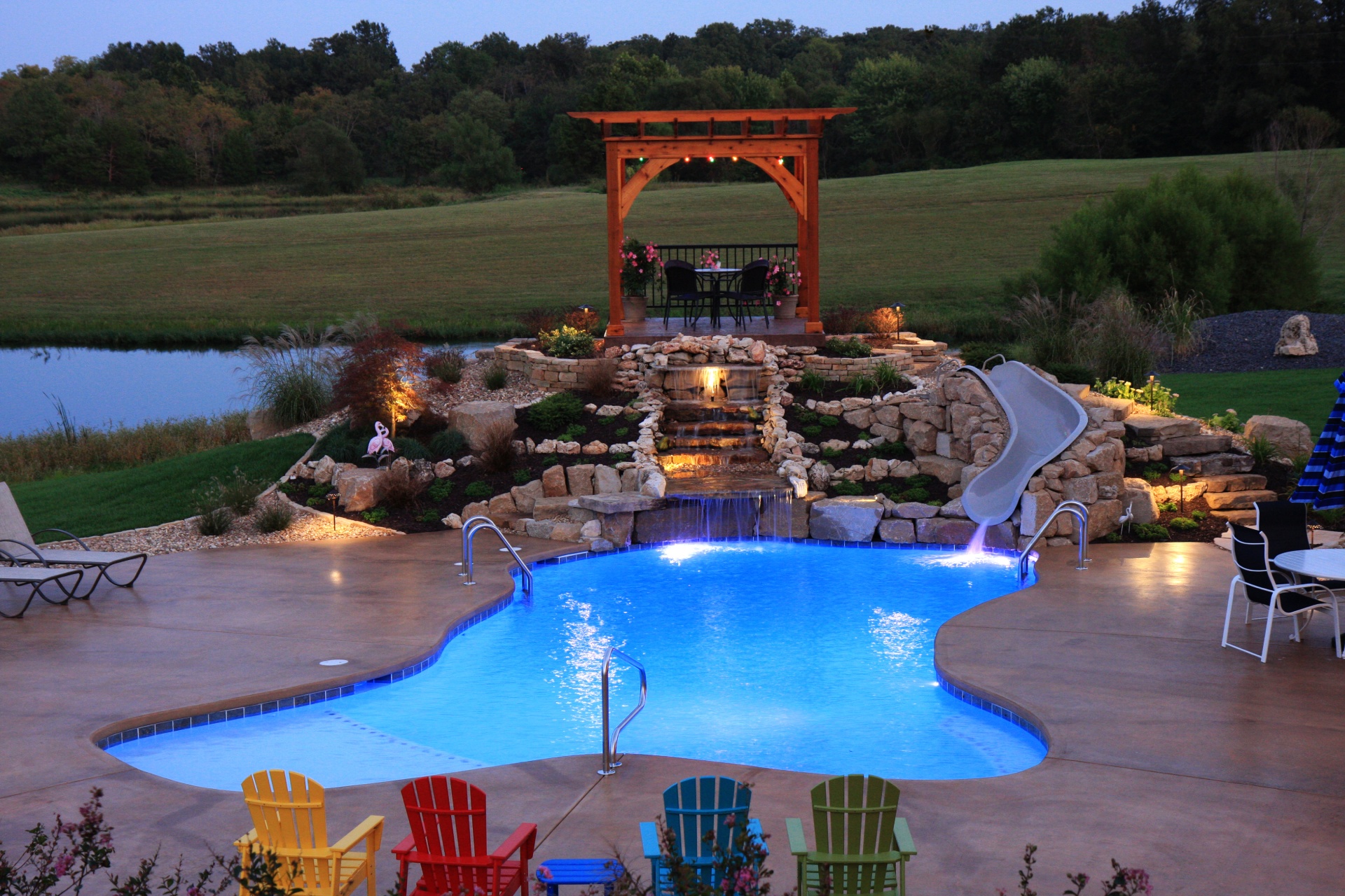 Gott Freeform Pool Gazebo & Waterfall at Twilight